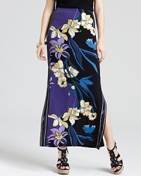 Blooming with graphic florals and saturated in after-dark shades, this T Tahari maxi skirt lends modern elegance to your summer style. Generous side slits set the stage for strappy sandals. Blooming with graphic florals and saturated in after-dark shades, this T Tahari maxi skirt lends modern elegance to your summer style. Generous side slits set the stage for strappy sandals.