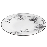 A captivating motif of lifelike orchids stands out in dramatic relief against a backdrop of vibrant white porcelain, giving this dinnerware from Michael Aram bold, artful presence. A captivating motif of lifelike orchids stands out in dramatic relief against a backdrop of vibrant white porcelain, giving this dinnerware from Michael Aram bold, artful presence.