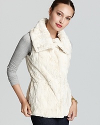 Plus faux fur lends ethereal spirit to a T Tahari vest for a sumptuous style statement. Plus faux fur lends ethereal spirit to a T Tahari vest for a sumptuous style statement.