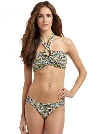 THE LOOKAbstract animal printAdjustable halter straps tie at neckBands crisscross at center with V-shaped openingPadded cups and side boningBack clasp closureTHE MATERIAL80% nylon/20% spandexFully linedCARE & ORIGINHand washImportedPlease note: Bikini bottom sold separately. THE LOOKAbstract animal printAdjustable halter straps tie at neckBands crisscross at center with V-shaped openingPadded cups and side boningBack clasp closureTHE MATERIAL80% nylon/20% spandexFully linedCARE & ORIGINHand washImportedPlease note: Bikini bottom sold separately.