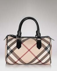 Burberry's iconic check lends luxe style to this classic bowling bag silhouette.