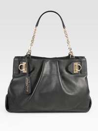 Ultra-luxe Italian leather with delicate pleats and cinching at the sides, adorned with a gleaming chain strap. Double chain shoulder straps, 8½ dropMagnetic snap closureProtective metal feetOne inner zip compartmentOne inside zip pocketTwo inside open pocketsFully lined15W X 10½H X 5½DMade in Italy Ultra-luxe Italian leather with delicate pleats and cinching at the sides, adorned with a gleaming chain strap. Double chain shoulder straps, 8½ dropMagnetic snap closureProtective metal feetOne inner zip compartmentOne inside zip pocketTwo inside open pocketsFully lined15W X 10½H X 5½DMade in Italy
