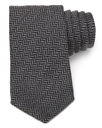 A premier silk tie from Armani Collezioni is a true classic in herringbone, a timeless pattern you can wear again and again. A premier silk tie from Armani Collezioni is a true classic in herringbone, a timeless pattern you can wear again and again.
