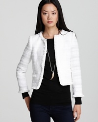 An Alice + Olivia jacket thinks outside the box with metallic accents and fringe detailing, creating a look that's four-sided chic. An Alice + Olivia jacket thinks outside the box with metallic accents and fringe detailing, creating a look that's four-sided chic.