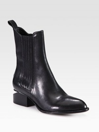 Fully commit from tip to toe in this architectural leather boot with a metal inverted heel and comfortable elastic panels. Stacked heel with metal notch, 1¾ (45mm)Shaft, 7Leg circumference, 10Leather upper with elastic stretch panelsPull-on styleLeather lining and solePadded insoleImported Fully commit from tip to toe in this architectural leather boot with a metal inverted heel and comfortable elastic panels. Stacked heel with metal notch, 1¾ (45mm)Shaft, 7Leg circumference, 10Leather upper with elastic stretch panelsPull-on styleLeather lining and solePadded insoleImported