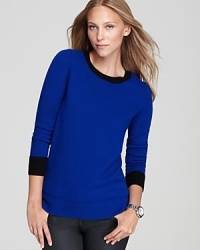 A cashmere essential, the C by Bloomingdale's crewneck sweater, gets chic new edge as color blocked trim and a high/low hem infuse the classic style with modern inspiration. A cashmere essential, the C by Bloomingdale's crewneck sweater, gets chic new edge as color blocked trim and a high/low hem infuse the classic style with modern inspiration.