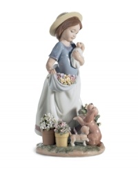 The picture of happiness. Lladro's A Romp in the Garden figurine features cute puppies, spring flowers and the sweet woman who takes care of them all in delicately glazed porcelain. The picture of happiness. Lladro's A Romp in the Garden figurine features cute puppies, spring flowers and the sweet woman who takes care of them all in delicately glazed porcelain.