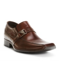 This pair of men's dress shoes puts some polish in your step. With the versatile modern design of these sleek slip-on Alfani loafers, as well as the metal ornament spanning the vamp, you're bound to stand out at the office. This pair of men's dress shoes puts some polish in your step. With the versatile modern design of these sleek slip-on Alfani loafers, as well as the metal ornament spanning the vamp, you're bound to stand out at the office.