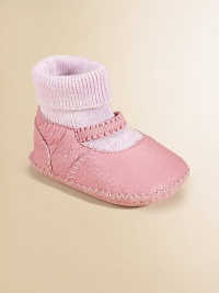 So precious in soft leather, lined in shearling to keep her toes toasty warm.Moccasin stitchingElasticized strapRibbed sock insertShearling liningLeather soleImported So precious in soft leather, lined in shearling to keep her toes toasty warm.Moccasin stitchingElasticized strapRibbed sock insertShearling liningLeather soleImported