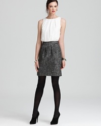 Giving the illusion of two pieces, this DKNY dress pairs a pleated top with a tweed skirt for polished perfect every time. Slip it on and step out in style. Giving the illusion of two pieces, this DKNY dress pairs a pleated top with a tweed skirt for polished perfect every time. Slip it on and step out in style.