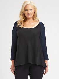 Lustrous charmeuse is styled with both elegance and wit, with a gentle nod to the pieced design of a classic baseball jersey, plus a pretty flared shape.Round banded necklineThree-quarter raglan sleevesSlightly flared shapeContour hemAbout 24 from shoulder to hemSilk/polyesterDry cleanMade in USA Lustrous charmeuse is styled with both elegance and wit, with a gentle nod to the pieced design of a classic baseball jersey, plus a pretty flared shape.Round banded necklineThree-quarter raglan sleevesSlightly flared shapeContour hemAbout 24 from shoulder to hemSilk/polyesterDry cleanMade in USA