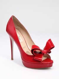 Couture-inspired, patent-leather design, finished with a bow that's simply divine. Covered heel, 5 (125mm) Covered platform, 1¼ (30mm) Compares to a 3¾ heel (95mm) Patent leather upper Leather lining and sole Padded insole Made in ItalyOUR FIT MODEL RECOMMENDS ordering one size up as this style runs small. Couture-inspired, patent-leather design, finished with a bow that's simply divine. Covered heel, 5 (125mm) Covered platform, 1¼ (30mm) Compares to a 3¾ heel (95mm) Patent leather upper Leather lining and sole Padded insole Made in ItalyOUR FIT MODEL RECOMMENDS ordering one size up as this style runs small.