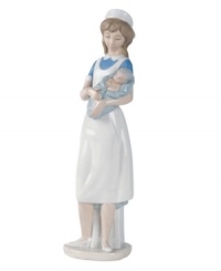 The picture of serenity and grace, a caring nurse lulls a child to sleep. Present the deserving caregiver in your life with this timeless, handcrafted porcelain figurine from Lladró. The picture of serenity and grace, a caring nurse lulls a child to sleep. Present the deserving caregiver in your life with this timeless, handcrafted porcelain figurine from Lladró.