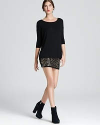 A hardware studded hem exudes edge on Bailey 44's embellished mini dress. A hardware studded hem exudes edge on Bailey 44's embellished mini dress.