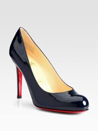 A wardrobe essential in shiny patent leather with simple lines and a sophisticated attitude. Self-covered heel, 4 (100mm) Round toe Leather lining Signature red leather sole Made in ItalyOUR FIT MODEL RECOMMENDS ordering one half size up as this style runs small. A wardrobe essential in shiny patent leather with simple lines and a sophisticated attitude. Self-covered heel, 4 (100mm) Round toe Leather lining Signature red leather sole Made in ItalyOUR FIT MODEL RECOMMENDS ordering one half size up as this style runs small.