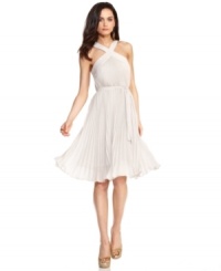BCBGMAXAZRIA's dress is completely magnetic: a flirty cut with classic pleating makes for a smoldering style. BCBGMAXAZRIA's dress is completely magnetic: a flirty cut with classic pleating makes for a smoldering style.