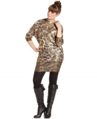 Unleash your animal instincts with Baby Phat's plus size sweater dress, flaunting a metallic leopard print! Unleash your animal instincts with Baby Phat's plus size sweater dress, flaunting a metallic leopard print!