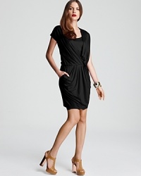 Fluid draping lends elegant dimension to this standout DKNY dress. Garnish with gold accents and step into the spotlight. Fluid draping lends elegant dimension to this standout DKNY dress. Garnish with gold accents and step into the spotlight.