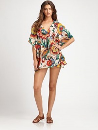 A breezy coverup with a vivid floral print. V-neckFlutter sleevesEmpire waistSelf-tieCottonDry cleanImported A breezy coverup with a vivid floral print. V-neckFlutter sleevesEmpire waistSelf-tieCottonDry cleanImported