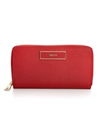 Strike it rich with this posh leather wallet from DKNY that features golden hardware and signature accents, while the thoughtful interior will organize your financial essentials with ease. Strike it rich with this posh leather wallet from DKNY that features golden hardware and signature accents, while the thoughtful interior will organize your financial essentials with ease.