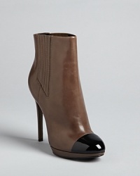 Ladylike perfection: these cap toe booties balance retro and modern aesthetics in a memorable silhouette: by B Brian Atwood. Ladylike perfection: these cap toe booties balance retro and modern aesthetics in a memorable silhouette: by B Brian Atwood.