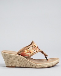 With the brand's signature whipstitched details, these colorfully embossed slides offer effortless summer style that shifts from day to night without hesitation. From Jack Rogers. With the brand's signature whipstitched details, these colorfully embossed slides offer effortless summer style that shifts from day to night without hesitation. From Jack Rogers.
