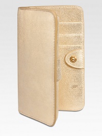 Designed to hold your iphone in slim, trim style, this case of glistening metallic goatskin slips right into your bag or pocket.HandcraftedFoldover snap closeiphone pocketThree card slots5¼L X 3WImported Designed to hold your iphone in slim, trim style, this case of glistening metallic goatskin slips right into your bag or pocket.HandcraftedFoldover snap closeiphone pocketThree card slots5¼L X 3WImported
