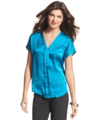 Make a stylish statement in Ellen Tracy's satin blouse. The easy-to-wear silhouette makes it a no-fuss piece with pants or skirts. Make a stylish statement in Ellen Tracy's satin blouse. The easy-to-wear silhouette makes it a no-fuss piece with pants or skirts.