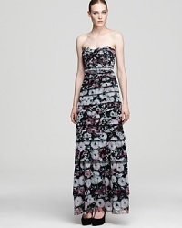 Capture attention in this strapless floral dress from BCBGMAXAZRIA. Thin tiers of printed fabric cascade down the body for a striking effect. Capture attention in this strapless floral dress from BCBGMAXAZRIA. Thin tiers of printed fabric cascade down the body for a striking effect.