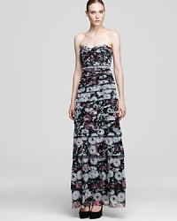 Capture attention in this strapless floral dress from BCBGMAXAZRIA. Thin tiers of printed fabric cascade down the body for a striking effect.