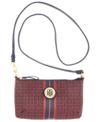 Live la vida logo with this signature print purse from Tommy Hilfiger. The compact crossbody design it adorned with golden hardware, monogram plaque and preppy center stripe, for an undecidedly uptown look. Live la vida logo with this signature print purse from Tommy Hilfiger. The compact crossbody design it adorned with golden hardware, monogram plaque and preppy center stripe, for an undecidedly uptown look.