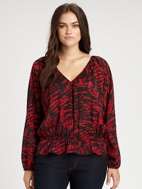 Pull on this printed blouse featuring a decolletage-complementing neckline. Its comfortable cinched waist ensures a feminine silhouette.V-necklineLong sleevesElasticized cuffsAllover printElasticized waistAbout 24 from shoulder to hemPolyesterMachine washImported Pull on this printed blouse featuring a decolletage-complementing neckline. Its comfortable cinched waist ensures a feminine silhouette.V-necklineLong sleevesElasticized cuffsAllover printElasticized waistAbout 24 from shoulder to hemPolyesterMachine washImported