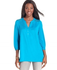 A lace inset at each shoulder and pretty pleating through the chest give this Style&co. top fashionable flair. A lace inset at each shoulder and pretty pleating through the chest give this Style&co. top fashionable flair.