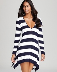 Nautical stripes on this Tommy Bahama coverup are fit for fashionable seaside living, and the lightweight knit provides just enough warmth from those chilly ocean breezes. Nautical stripes on this Tommy Bahama coverup are fit for fashionable seaside living, and the lightweight knit provides just enough warmth from those chilly ocean breezes.