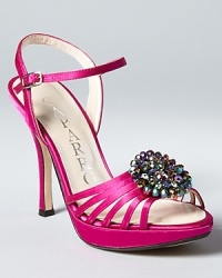 In hot rose satin, these bejeweled strappy sandals from Caparros add colorful glamour to a fashionable evening. In hot rose satin, these bejeweled strappy sandals from Caparros add colorful glamour to a fashionable evening.