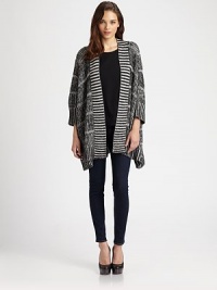 Chunky rib-knit, slightly oversized in a slouchy open-front topper.Open frontDropped shouldersTapered fit85% viscose/15% woolDry cleanImportedModel shown is 5'10 (177cm) wearing US size Small. Chunky rib-knit, slightly oversized in a slouchy open-front topper.Open frontDropped shouldersTapered fit85% viscose/15% woolDry cleanImportedModel shown is 5'10 (177cm) wearing US size Small.