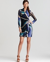 Emboldened by a blazing whirl of hue, this Karen Kane wrap dress ignites your everyday style. Step up the classic silhouette with strappy sandals.