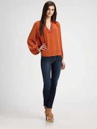 Feather-light silk v-neck has embroidered trim and long bishop sleeves. V-neckLong bishop sleevesSplit back yokeSilkDry cleanImportedModel shown is 5'10 (177cm) wearing US size Small. Feather-light silk v-neck has embroidered trim and long bishop sleeves. V-neckLong bishop sleevesSplit back yokeSilkDry cleanImportedModel shown is 5'10 (177cm) wearing US size Small.