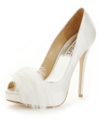 Light as a feather. Spend the evening floating on air with the Ginnie platform pumps by Badgley Mischka, featuring a sultry suede silhouette with sky-high heel and saucy feather embellishment. Light as a feather. Spend the evening floating on air with the Ginnie platform pumps by Badgley Mischka, featuring a sultry suede silhouette with sky-high heel and saucy feather embellishment.