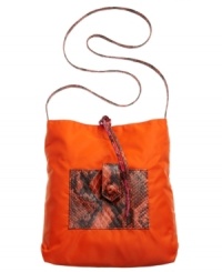 A casual nylon silhouette accented with a bold snakeskin print. This FALCHI by Falchi crossbody will bring life to any ensemble and get you to your destination in exotic style. Bonus: this style is reversible! A casual nylon silhouette accented with a bold snakeskin print. This FALCHI by Falchi crossbody will bring life to any ensemble and get you to your destination in exotic style. Bonus: this style is reversible!