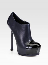 Sleek leather ankle boot with a hidden platform, towering heel and shiny patent cap toe. Self-covered heel, 4¼ (110mm)Hidden platform, 1¼ (30mm)Compares to a 3 heel (75mm)Leather upper with a patent leather cap toeSide zipLeather lining and solePadded insoleMade in Italy Sleek leather ankle boot with a hidden platform, towering heel and shiny patent cap toe. Self-covered heel, 4¼ (110mm)Hidden platform, 1¼ (30mm)Compares to a 3 heel (75mm)Leather upper with a patent leather cap toeSide zipLeather lining and solePadded insoleMade in Italy