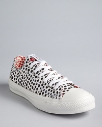 Spot on: these classic Converse All Star Sneakers take on fashion flair in a fun polka dot print. Mix and match the red and white laces, depending on your mood. Spot on: these classic Converse All Star Sneakers take on fashion flair in a fun polka dot print. Mix and match the red and white laces, depending on your mood.