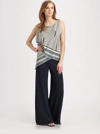 A unique top with fashion-forward details like asymmetrical sleeves and a sarong-inspired bodice.Draped neckAsymmetrical sleeves and hemSarong-style silhouetteAbout 25 from shoulder to hemCottonDry cleanMade in Italy Model shown is 5'9 (175cm) wearing US size Small. A unique top with fashion-forward details like asymmetrical sleeves and a sarong-inspired bodice.Draped neckAsymmetrical sleeves and hemSarong-style silhouetteAbout 25 from shoulder to hemCottonDry cleanMade in Italy Model shown is 5'9 (175cm) wearing US size Small.