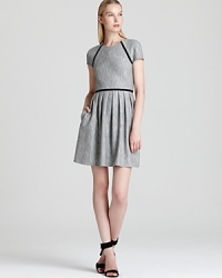 Classic tweed gets a fashion-forward lift from chic black piping on this Tibi dress, touting an of-the-moment pleated skirt. Polished for workdays, it doubles as a dinner option when you add strappy heels. Classic tweed gets a fashion-forward lift from chic black piping on this Tibi dress, touting an of-the-moment pleated skirt. Polished for workdays, it doubles as a dinner option when you add strappy heels.