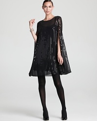 Floaty layers of sheer chiffon drip with dazzling sequins for a DKNY cape designed to steal the spotlight. Slip the luxe layer over leather pants for serious fashion presence. Floaty layers of sheer chiffon drip with dazzling sequins for a DKNY cape designed to steal the spotlight. Slip the luxe layer over leather pants for serious fashion presence.
