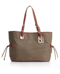 A new casual classic: The roomy nylon purse by Calvin Klein totes it all, workweek or weekend. A new casual classic: The roomy nylon purse by Calvin Klein totes it all, workweek or weekend.