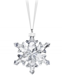 Swarovski makes winter magic with the 2012 annual snowflake ornament. Delicate cut crystal creates a flurry of sparkle and shine on your tree or hanging in a window. With dated metal charm. Swarovski makes winter magic with the 2012 annual snowflake ornament. Delicate cut crystal creates a flurry of sparkle and shine on your tree or hanging in a window. With dated metal charm.