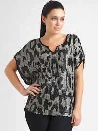 A stunning pattern of sequins creates a sophisticated shimmer on this shapely dolman sleeve top of silky modal knit.Scoop neckline with center notchShort dolman sleevesPieced waistContrast pipingAbout 28 from shoulder to hemModalSpot cleanImported A stunning pattern of sequins creates a sophisticated shimmer on this shapely dolman sleeve top of silky modal knit.Scoop neckline with center notchShort dolman sleevesPieced waistContrast pipingAbout 28 from shoulder to hemModalSpot cleanImported