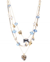 Create a look all your own in this whimsical style by Betsey Johnson. This delicate illusion necklace combines heart and ribbon charms with sparkling blue and clear faceted beads. Set in mixed metal. Approximate length: 16 inches + 3-inch extender. Approximate drop: 2-1/2 inches.
