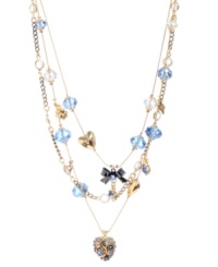 Create a look all your own in this whimsical style by Betsey Johnson. This delicate illusion necklace combines heart and ribbon charms with sparkling blue and clear faceted beads. Set in mixed metal. Approximate length: 16 inches + 3-inch extender. Approximate drop: 2-1/2 inches. Create a look all your own in this whimsical style by Betsey Johnson. This delicate illusion necklace combines heart and ribbon charms with sparkling blue and clear faceted beads. Set in mixed metal. Approximate length: 16 inches + 3-inch extender. Approximate drop: 2-1/2 inches.
